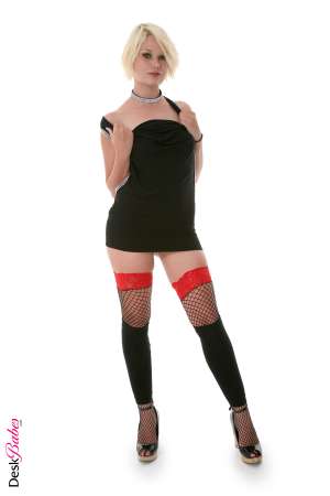 Stripper Picture of Ivana Doll - Ivana Doll was discovered walking the fashion forward streets of Paris France. Ivana loves goth clubs deep earthy bass beats and having all eyes on her when she's on the dance floor. Seeing her in a sexy pair of thigh high stockings will have you drooling before she even peels off one ounce of her seductive lingerie. Blonde bold and beautiful meet Ivana Doll.