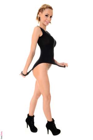 Stripper Picture of Erica Fontes - Erica Fontes is a hot bundle of energy and she knows how to let loose and have fun. Erica has a carefree attitude and she lives life to the fullest. She is always up for an adventure and she freely admits that many of her best adventures have happened while she was naked! Erica has big boobs and loves high heels and if you want to know where she is pierced and tattooed you'll have to download one of her full stage shows.