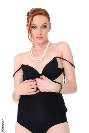 Stripper Picture of Amber Cute - Amber Cute went to her first strip club six months ago and decided that she wanted to be an exotic dancer then and there. Always the best at what she does Amber came straight to our studio to dance for the best of the best. Amber is a sexy red head with flawless alabaster skin. She has tiny tits with tiny nipples that stand erect during her entire stage show proving just how turned on she gets when she dances. Let Amber be your fantasy as she entices you with every shake shimmy and grind.