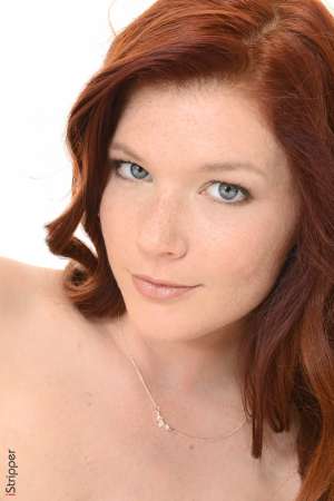 Stripper Picture of Mia Sollis - Mia Sollis is a sexy redhead that we know you are going to love. She is the kind of classy lady that makes everyone feel good when they talk with her. Mia is a self proclaimed people person and she believes it is what makes her striptease performances so special. Mia really connects with her fans and enjoys providing one on one real girlfriend experiences. So connect with Mia and download all her erotic escapades.