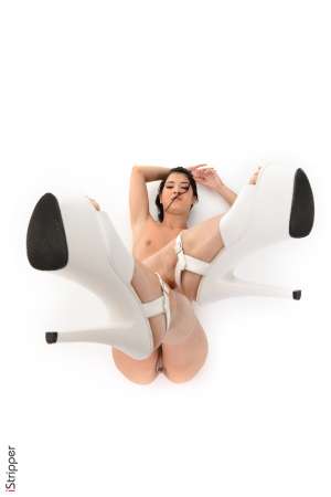 Stripper Picture of Lady Dee - Lady Dee is a beautiful brunette from the Czech Republic. Her petite and skinny stature has gained her fans the world over and we are proud to have her dancing with us. Lady Dee is smart well educated and incredibly witty. She has a magnetic personality that draws people to her and someday she hopes to practice psychology for that reason. But for now she is very happy getting to perform on stage. She tells us that it's a total rush to get naked in front of a camera and she enjoys the freedom of creating her own work hours. An avid reader Lady Dee's ideal date is to meet in a bookstore for a cup of coffee and discuss literature for hours. But she also likes getting dressed to the nines and hitting the town for the night!