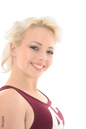 Stripper Picture of Tricia Teen - Tricia is a nineteen-year-old blonde beauty from Budapest Hungary. Tricia is a kind and caring person which made her decide to pursue a career in nursing. But University is expensive and the lovely Tricia needed a way to pay for her studies. She started modeling nude for art students and found it thrilling to be naked in front of a crowd. Tricia expanded her repertoire to include wet t-shirt contests (which she won) and finally exotic dancing. Be sure to get a front row seat when this beauty takes the stage because she burns up the dance floor like no other! When Tricia isn't dancing or studying for her boards she enjoys going out to eat with friends and watching classic black and white movies in her pajamas with a bowl of popcorn.