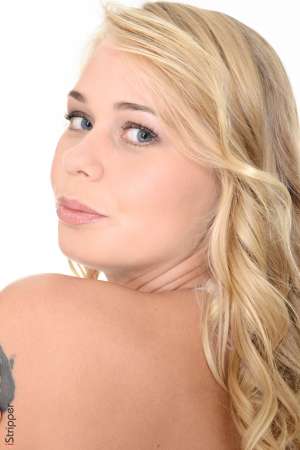 Stripper Picture of Sarika - Sarika is a beautiful blonde from Russia that we know you are going to love. She has big breasts multiple piercings and tattoos which hint at her naughty side. And what a naughty side it is! Sarika has an obsession with high heels and loves to wear them in bed for a bit of extra kink. Sarika tells us that she likes to drag her heels up and down her lovers backs as they satisfy her desires in bed. When she's not entertaining lovers Sarika enjoys working out at the gym and traveling to beaches with crystal clear blue water.