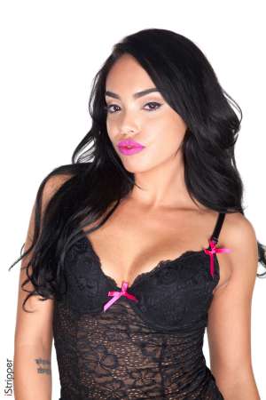 Stripper Picture of Selena Santana - If you've been nice Selena Santana is ready to be naughty for you this holiday season! Get a good look at Santa's favorite Elf as she struts her stuff in candy red shoes a lickable mini-skirt and the tightest knee-high white stockings. It's enough to make your nose glow red with glee and we do hope it's the perfect start to the most wonderful holiday you've ever had. Happy holidays! XXoXooXo