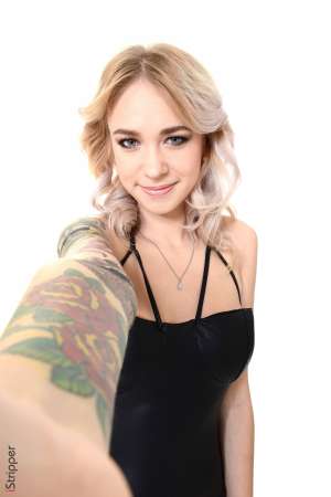 Stripper Picture of Arteya - Arteya is a 21 year old blonde beauty from Russia and she is beyond excited to be making her debut here. It may be hard to believe but Arteya describes herself as shy and introverted when she's not on stage. For that reason Arteya loves when fans come up and introduce themselves to her because it breaks the ice. But the second she hits that stage it's a different story. Arteya definitely gets off on performing for a crowd. It makes her feel sexy and horny all at the same time. In her personal life Arteya giggles as she tells us she loves foot play. She has a bit of a foot fetish and she always makes sure her toes are on point just in case someone wants to suckle on them!