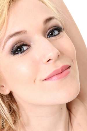 Stripper Picture of Aislin - Aislin is a pretty 21-year-old blonde from Kiev Ukraine. She went to her first strip club with a bunch of friends a little over a year ago where someone bought her a lap dance. Having a beautiful diva throw her arms around her neck and start grinding her hips on her was enough to make Aislin realize she too wanted to turn people on in that way. Aislin knew she knew how to move her hips in bed but she enrolled in pole dancing lessons to learn the finer points of dancing and performing on stage. The rest is history and now she is a feature dancer with dedicated fans all over the world. When she's not performing on stage Aislin says she tends to be a homebody. She loves snuggling up on her couch with a good book and a cozy blanket. She also practices yoga twice a week and likes to try and cook different foods from around the world. She says tries because some have been wild successes and others not so much! We know you are going to love Aislin so keep an eye out for this up and coming star!