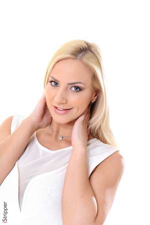 Stripper Picture of Nathaly Cherie - Nathaly Cherie is a blonde bombshell by all definitions. She's got big boobs a great ass she looks stunning in heels she's got a beautiful face light eyes and she loves to push the envelope with her stage shows. Nathaly is into sexy tattoos erotic piercings and in her personal life she gets great pleasure out of anal erotica. Nathaly is amazing every time she hits the stage and we know you will love her.