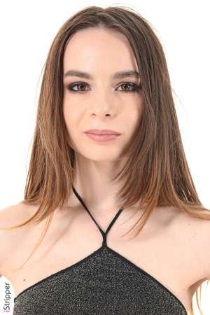 Stripper Picture of Debora A - Debora is born 22 years ago in Ukrania. Black long hair brown smily eyes a rose on upper left thigh. Debora starts to get a really great notoriety and she enchants all the photographers she has worked with including us! Apart from her modeling career she plays the drums and would like to become Director of Video Clips. She loves acting and whatever outfit she wears she's just perfect in it! Working girl pink teen sensual goddess her shows with iStripper are all fantastic!