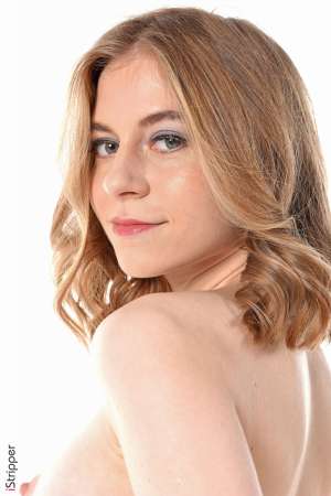 Stripper Picture of Shayla - Shayla is just 21 she comes from Ukraine and is very new to the adult modeling. She's a shy slim beauty with a soft skin and touching poses. Shayla dreams of moving to the United States. She plays the piano and drums and spend most of her free time at home in comfortable pyjamas playing music and hugging her dogs...