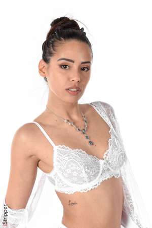 Stripper Picture of Andreina Deluxe - Andreina is a pure latina she's from Columbia and came to our studios with her sexy 26 years including 6 without having a hair cut! Her sublime slim tan body and irresitible smile are an absolut must! Andreina is not only an adult model she's also a confirmed violonist! She loves traveling cooking doing some shopping and.. sleeping! When we asked her to describe herself she said she's always honest generous and helpful... Andreina is too perfect to be real