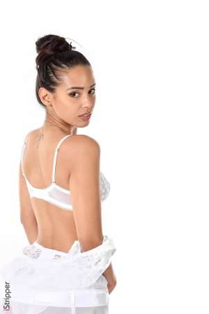 Stripper Picture of Andreina Deluxe - Andreina is a pure latina she's from Columbia and came to our studios with her sexy 26 years including 6 without having a hair cut! Her sublime slim tan body and irresitible smile are an absolut must! Andreina is not only an adult model she's also a confirmed violonist! She loves traveling cooking doing some shopping and.. sleeping! When we asked her to describe herself she said she's always honest generous and helpful... Andreina is too perfect to be real