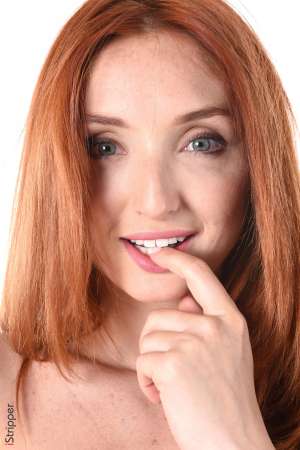 Stripper Picture of The Red Fox - Calling herself The Red Fox this beauty from the Ukraine considers herself a performance artist. Yes she is a stripper but every dance is intimate to her and she wants it to be incredibly intimate for you to watch. The Red Fox studied Art History and Acting at University which is when she started dancing erotically to pay for tuition. Soon she found it more pleasurable to dance on stage and feel the sexual energy generated by the crowd then to study from a book all day.And that is when The Red Fox was created. Now you can enjoy every curve of her body and every roll of her hip as often as you want when you download her world famous stage shows.