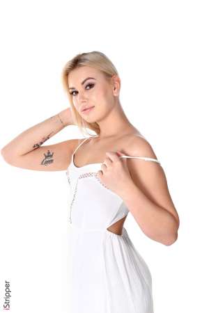 Stripper Picture of Sandra Blonde - Sandra is 22 she comes from Kiev Ukraine where shes studies economics. Sandra's body is voluptuous; her sweet & clear skin is an invitation to caress her and her lips a promise of pleasure. She's quite tall but still love wearing high heels :) She spent a lot of time in our dressing room amazed by the huge choice of sexy outfits she could wear :) The result is a great range of styles that she embodies like any one else!