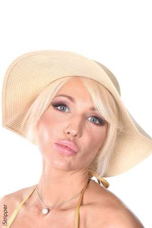 Stripper Picture of Bad Barbie - Here is Bad Barbie from Russia. Barbie's beauty is so incredible that it makes her almost unreal... She has slim long legs a perfect tanned skin an angel face and amazing deep blue eyes... She's a professional dancer and teaches belly dancing & gogo dancing. she is very interested in naturopathy and devotes a lot of time to creating her own beauty products based solely on natural products. She is a sweet and empathic woman a treat to work with!