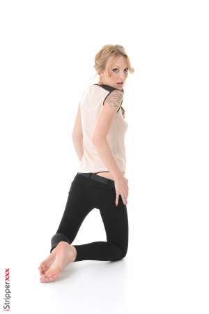 Stripper Picture of Belle Claire - Belle Claire came to us straight from the runway. Fashion is her passion and she is designing her own high end lingerie line for women that love women. Did we mention that Belle is a total bisexual. She loves a woman's curves and tells us there will always be both men and women in her personal life. Belle loves flirting and taking a woman home getting her naked and discovering where all her hidden tattoos are! She calls them artistic presents.