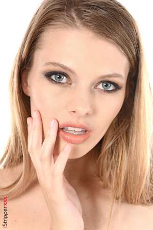 Stripper Picture of Sophie Sparks - Sophie Sparks comes from the US. Splendid blond beauty with big blue eyes & silky hair Sophie is quite rare on the Internet and reserves her apparitions only to the productions she values the most... What an honor for iStripper!! Sophie is full of surprises! Not only she's an amazing performer but she also speaks fluent chinese plays ukulele and is fan of rock n roll music!