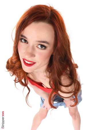 Stripper Picture of Sherice - Sherice is a redhead beauty from Russia where she's born 20 years ago. She's very slim and sensual with long hair and a natural ability to play all kinds of roles :) Sherice studies economics at the university her goal is to enter an international company and possibly move to the USA. Apart from that she plays bass and already performed several concerts with her band!