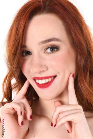 Stripper Picture of Sherice - Sherice is a redhead beauty from Russia where she's born 20 years ago. She's very slim and sensual with long hair and a natural ability to play all kinds of roles :) Sherice studies economics at the university her goal is to enter an international company and possibly move to the USA. Apart from that she plays bass and already performed several concerts with her band!